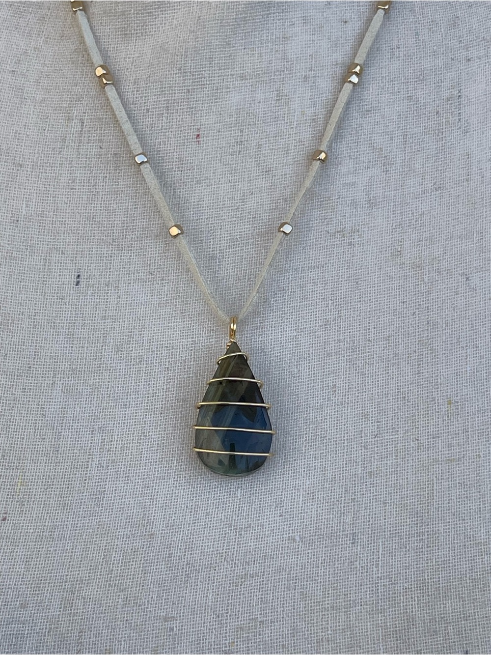 Gold Wrapped Teardrop Labradorite Necklace with Green Flash on White Suede Cord